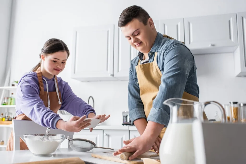 Two disabled friends with down syndrome baking
